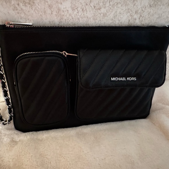 Michael Kors Black Dakota/Rose wristlet or clutch.